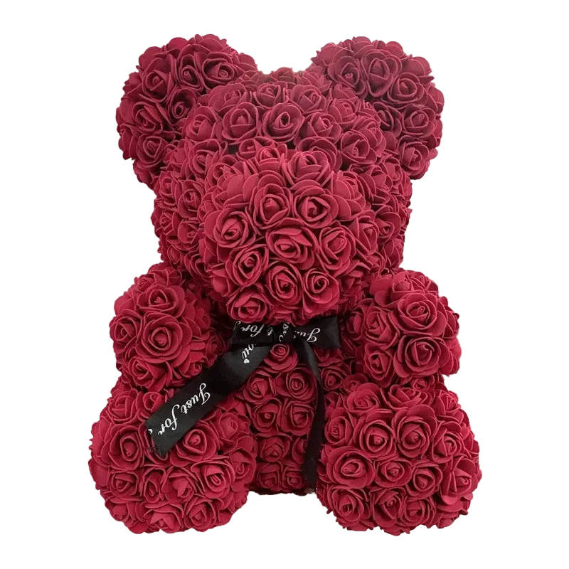 Red rose teddy bear with a black ribbon on a white background