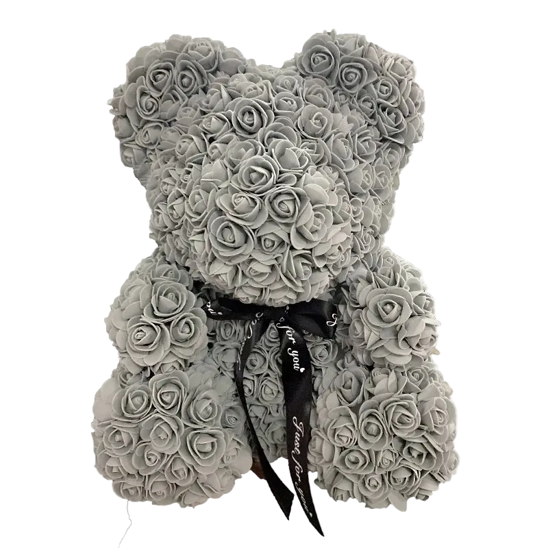 Gray rose teddy bear with a black ribbon on a white background