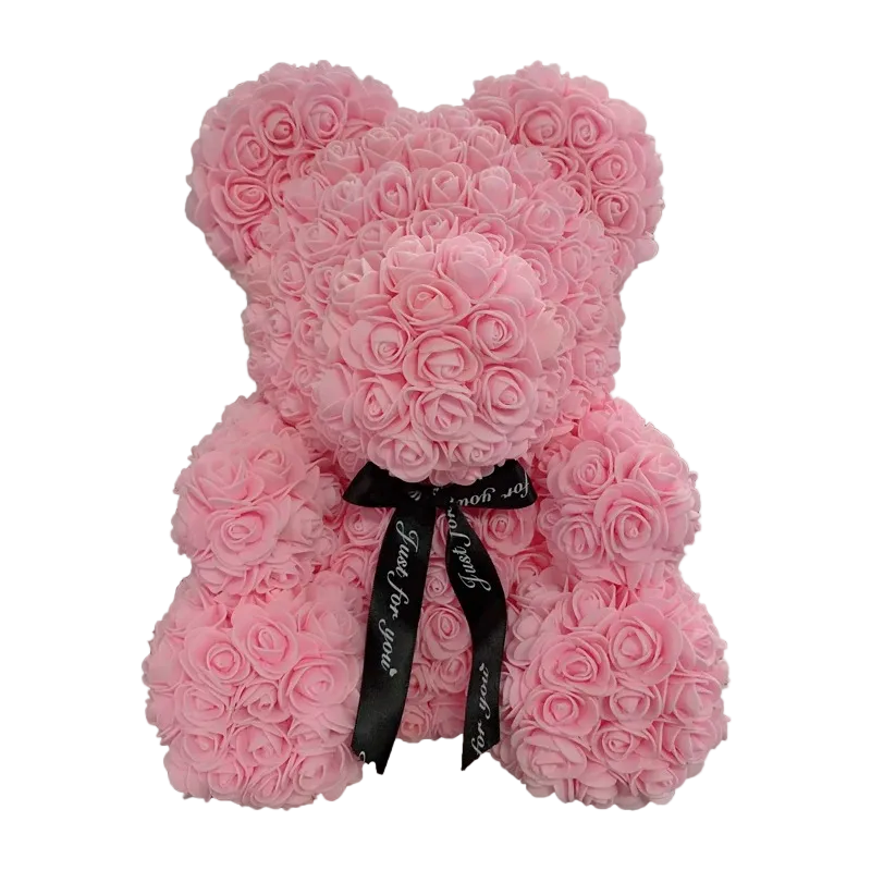 Pink teddy bear made of roses with a black ribbon on a white background