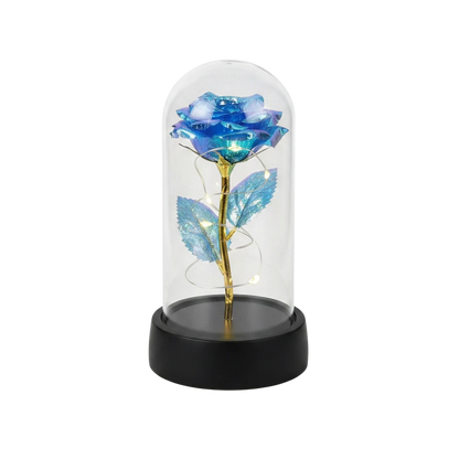 MieleGifts blue iridescent rose inside a clear plastic dome with warm LED fairy lights on a black base