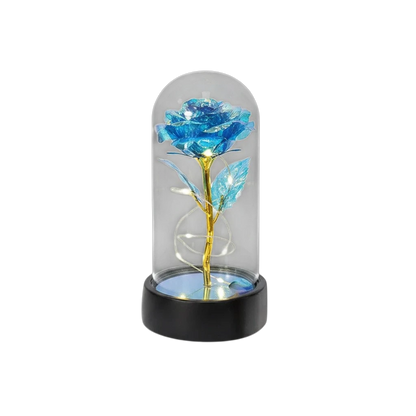 MieleGifts blue iridescent rose inside a clear plastic dome with glowing LED fairy lights and a black base.