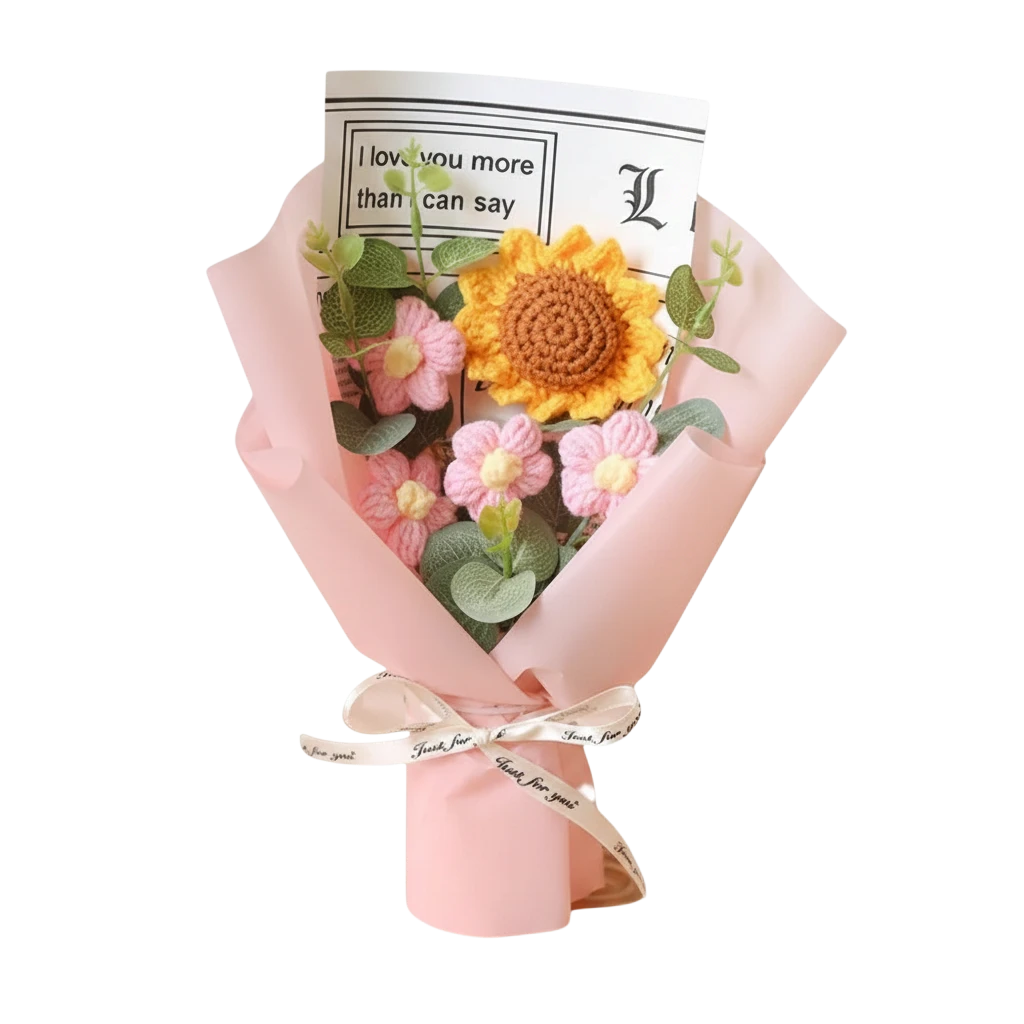 MieleGifts handcrafted crochet flower bouquet featuring a yellow sunflower, pink daisies, and eucalyptus in pink wrap.