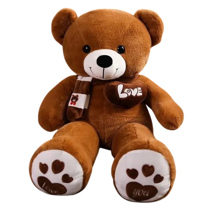 MieleGifts giant brown plush teddy bear wearing a striped scarf with a Love heart patch and paw prints on feet.