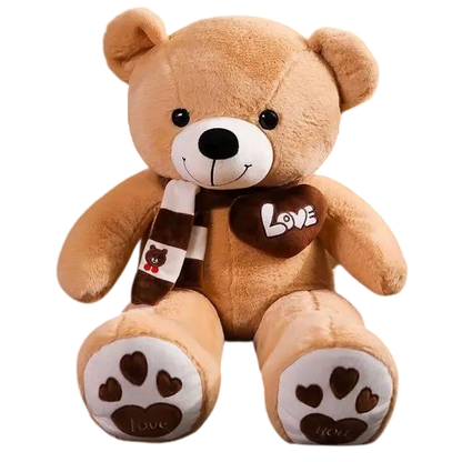 MieleGifts giant brown plush teddy bear wearing a striped scarf with a Love heart patch and heart-printed paws.