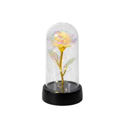 MieleGifts iridescent rose in a clear plastic dome with warm LED fairy lights on a black base