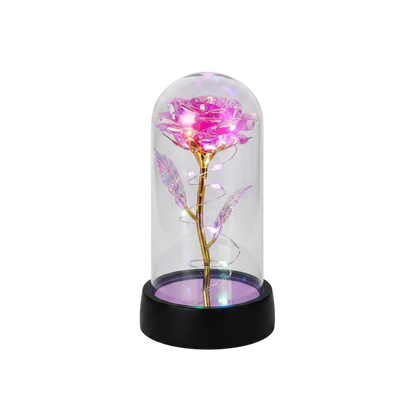 MieleGifts iridescent pink rose inside a clear plastic dome with glowing LED fairy lights on a black base