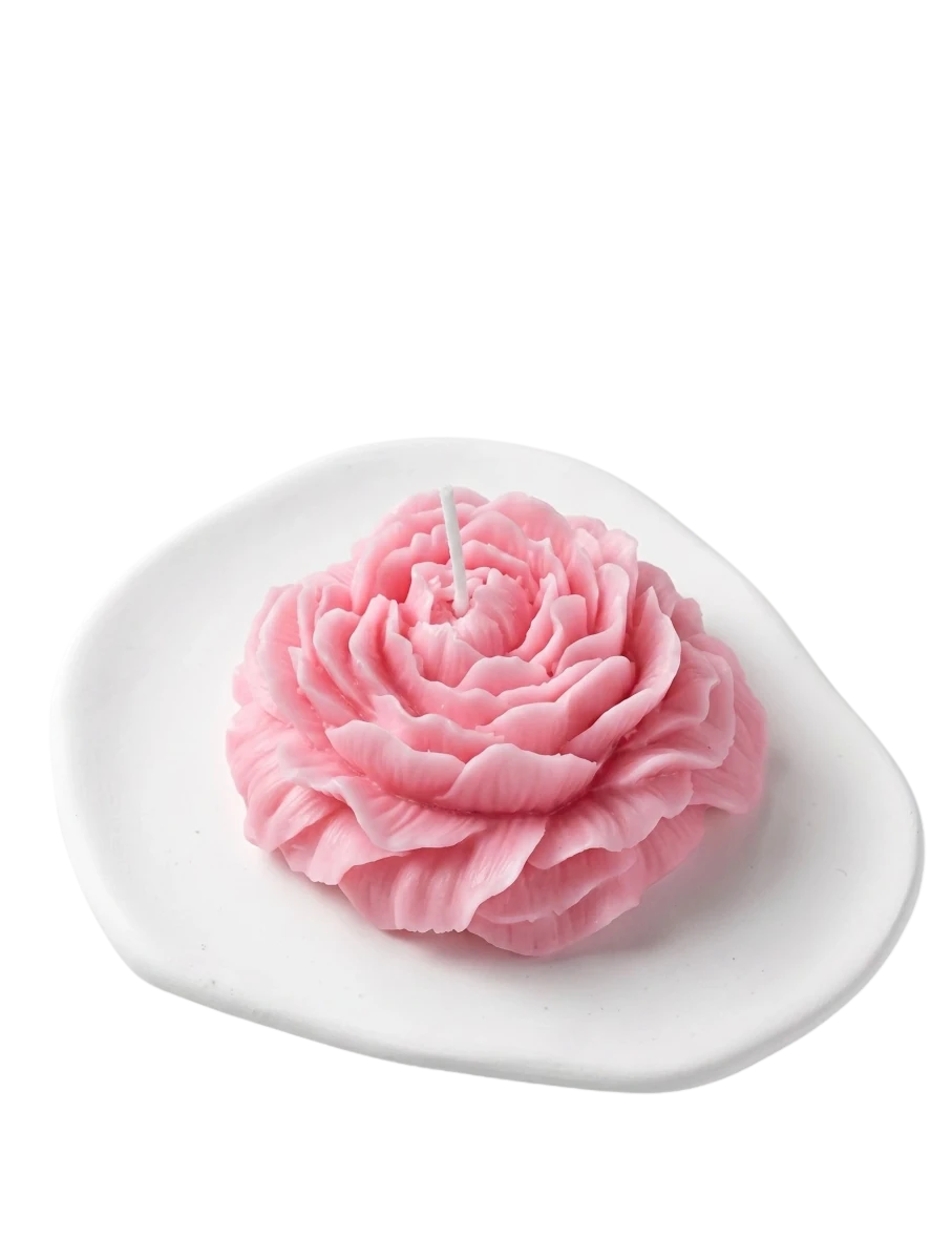 MieleGifts pink peony flower shaped soy wax candle on a white ceramic dish