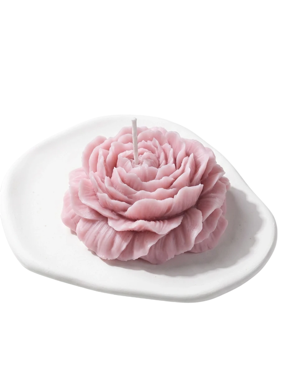 MieleGifts pink peony flower shaped soy wax candle on a white ceramic tray