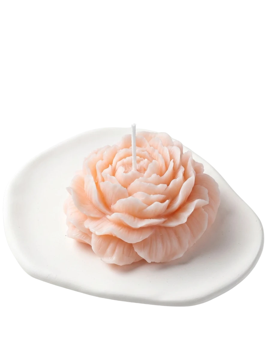 MieleGifts pink peony shaped soy wax candle on a white ceramic tray