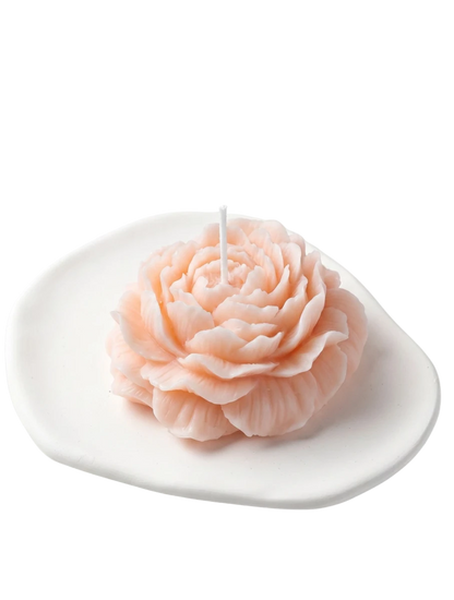 MieleGifts pink peony shaped soy wax candle on a white ceramic tray