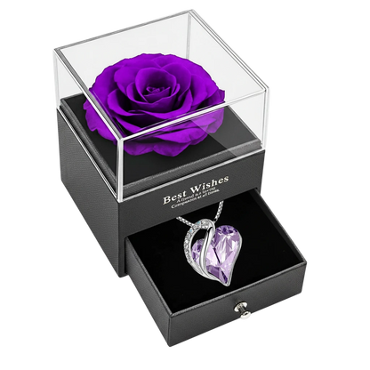 MieleGifts preserved purple rose in a black leatherette box with a pull-out drawer containing a crystal heart necklace.