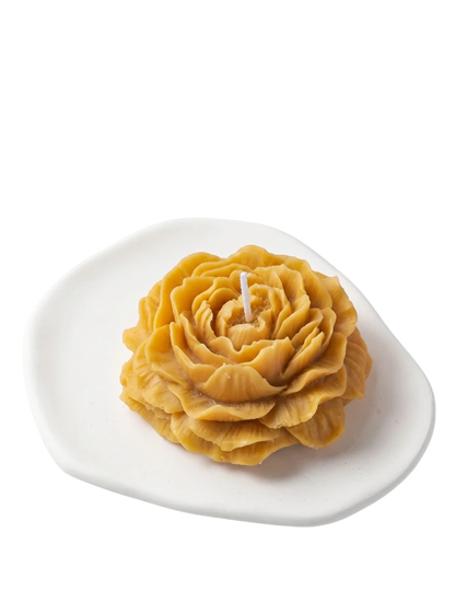 MieleGifts golden yellow peony shaped soy wax candle on a white ceramic tray