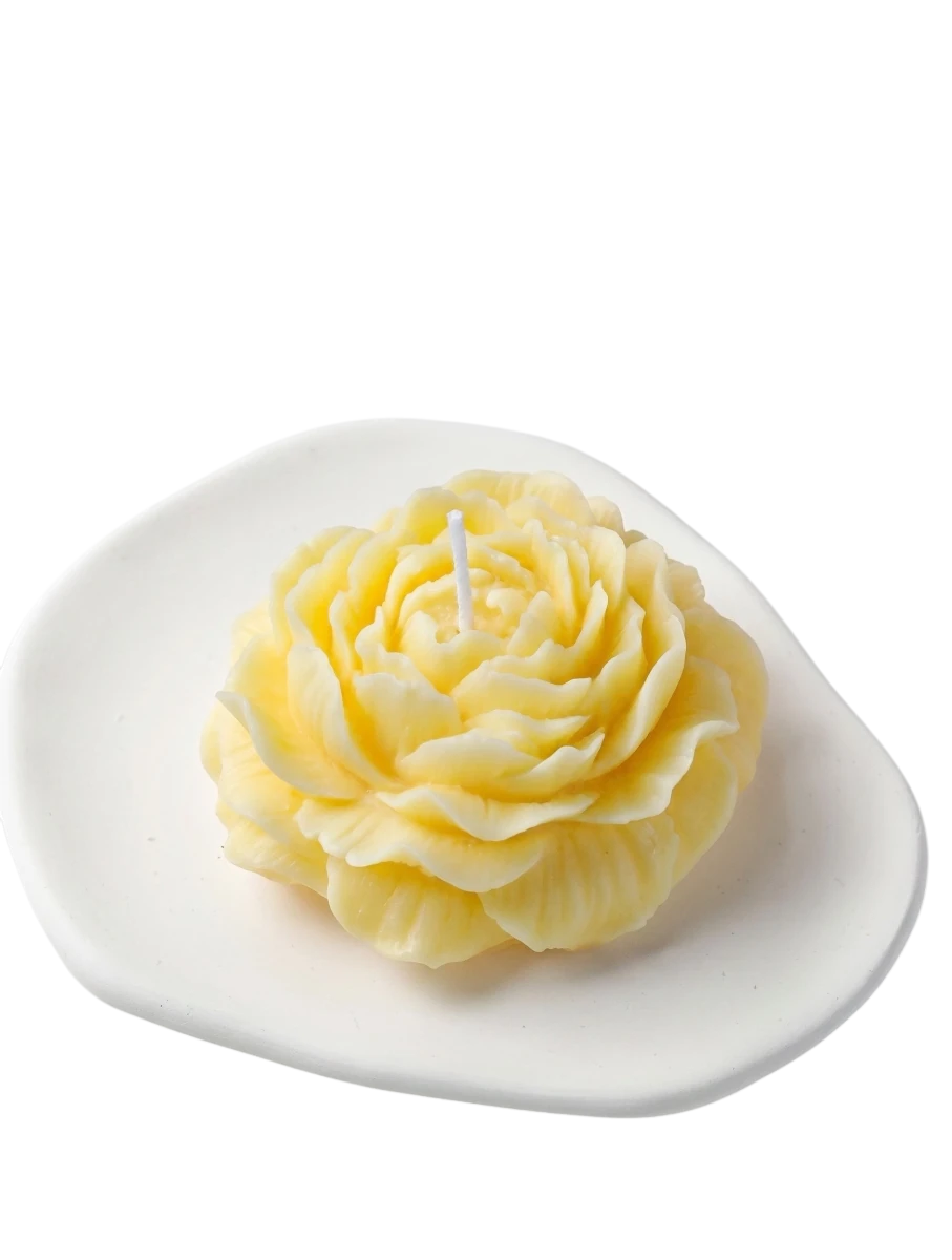 MieleGifts yellow peony flower shaped soy wax candle on a white ceramic tray