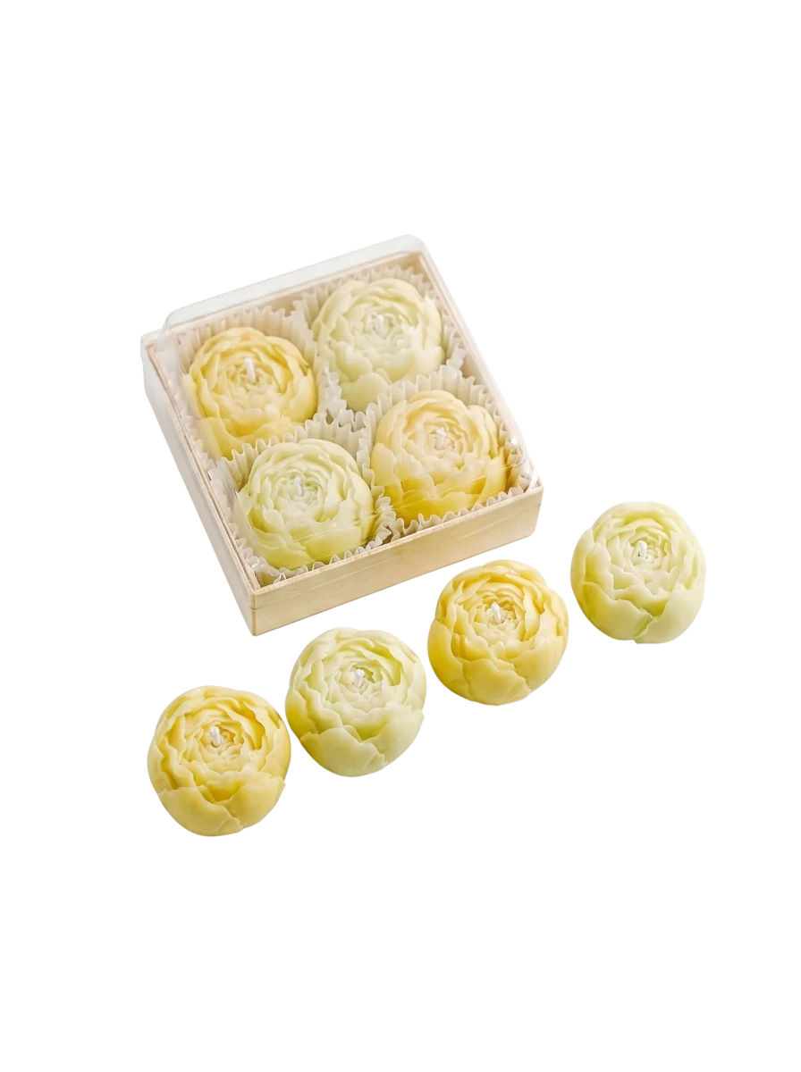 MieleGifts miniature yellow rose-shaped soy wax candles in a clear display box on a white background